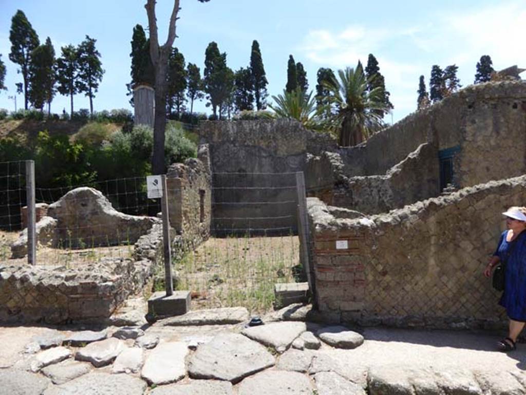 Ins. Orientalis I, 3, Herculaneum, July 2015. Looking east towards entrance to stable area on north side of house, with the ramp in the pavement. Photo courtesy of Michael Binns.